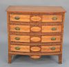 Federal bowed front four drawer chest with figured maple paneled drawer fronts and drop center, brasses having head of eagle with sn...