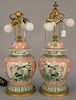 Pair of E.F. Caldwell Chinese famille verte covered jars made into table lamps with pleated silk shades, bronze base marked: E.F. Ca...