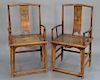 Pair of Chinese elmwood armchairs, splat back over panel seat and stretcher base.  height: 41 in.