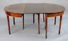 Federal mahogany two part dining table with three made to fit leaves.  
height 29 1/2 in., diameter 52 in., opens to 121 in.