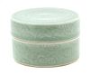 A Molded Celadon Glaze Porcelain Lidded Box Height 2 3/4 inches.