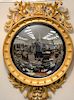 Large girandole mirror with foliate pierced top and bottom. 
height 56 in., diameter 39 in.