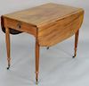 Sheraton mahogany drop leaf breakfast table on turned and fluted legs, circa 1830. 
height 29 1/4 in., top closed: 22 1/4" x 38", to...