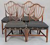 Set of four of Federal side chairs having shield backs with over upholstered seats, set on molded legs with H stretchers, probably M...