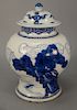 Chinese porcelain urn with blue decorated animals, birds, and clouds, 17th or 18th century, now fitted with replaced cover (chips an...