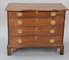 Cherry four drawer chest having molded overhanging top over conforming serpentine drawers set on bracket feet. 
height 33 in., width...