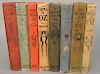 Group of eight Frank Baum first edition OZ books, Four Reilly & Lee to include "The Tin Woodman", "Dorothy and the Wizard in OZ", "O...