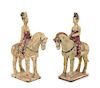 A Pair of Painted Pottery Figures of Equestrians Height of pair 11 1/4 inches.