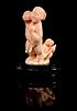 * A Carved Coral Figural Group Height 4 1/4 inches (with stand).