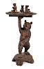 A Black Forest Carved Wood Smoking Stand Height 36 inches.