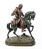 * A Cast Metal Figure of a Horse and Rider Height 25 inches.