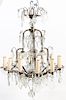 A Gilt Metal and Glass Twelve-Light Chandelier Height 33 1/2 x diameter 24 inches.