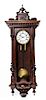 A Victorian Walnut Wall Clock Length 40 inches overall.