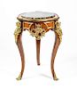 A Louis XV Style Gilt Metal Mounted Table Height 33 x diameter of top 21 1/4 inches.