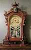 A Victorian Mantel Clock, Height 24 x width 15 1/2 x depth 5 3/4 inches.