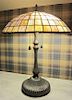 A Leaded Glass Table Lamp, Height 23 x diameter of shade 18 inches.