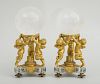 PAIR OF LOUIS XVI STYLE CHERUB-FORM STANDS AND A PAIR OF ROCK CRYSTAL SPHERES