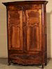 PROVINCIAL LOUIS XV STYLE CARVED FRUITWOOD ARMOIRE