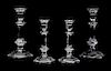 Four Baccarat Candlestick Holders Height of tallest 8 7/8 inches.