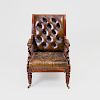 Fine Near Pair of Late Regency Mahogany and Tufted Leather Upholstered Retractable Armchairs