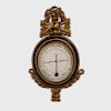 A French Empire Parcel-Gilt and Ebonized Wood Barometer