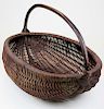 large early 20th c. buttocks style basket