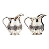 A PAIR OF SILVER CREAM JUGS