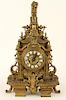 LATE 19TH C. BRASS MANTLE CLOCK WITH LION FIGURE