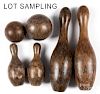 Antique wooden bowling balls and pins.