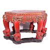 A 19th century red lacquered Chinese table.