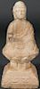 A CHINESE CARVED LIMESTONE BUDDHA, POSSIBLY MING