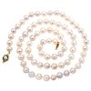 A South Sea Pearl necklace with cultured pearl and diamond 14K yellow gold clasp.