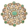 An emerald and diamond 18K yellow gold and silver brooch.