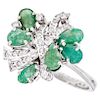 An emerald and diamond palladium silver ring.