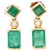 A pair of emerald and diamond 14K and 10K yellow gold earrings.