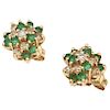 A pair of emerald and diamond 14K yellow gold stud earrings.
