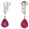 A pair of ruby and diamond 14K white gold earrings.