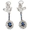 A pair of sapphire and diamond palladium silver earrings.