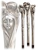 53. Silver Figural Art Nouveau Cane -Ca. 1900  -Well modeled to depict the head of a young beauty with a charming face and opulent hair, flower petals