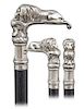 164. Lion Knobkerrie Cane -Ca. 1870 -L-shaped and heavy cast white metal lion cane, ebony shaft and a metal ferrule. The prone lion comes on an elabor