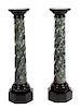 A Pair of Faux Marble Urns on Pedestals Height 64 inches.