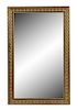 A Neoclassical Style Gilt Metal and Ebonized Mirror Height 63 x width 39 1/2 inches.