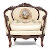 A Louis XV Style Carved Mahogany Bergere Height 33 1/2 x width 36 inches.