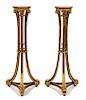 A Pair of Louis XVI Style Carved Torcheres Height 47 3/4 x diameter at top 10 inches.