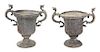 A Pair of English Cast Lead Garden Urns Height 22 1/2 x width 24 1/2 x depth 14 inches.