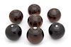 A Group of Seven English Lignum Vitae Lawn Bowling Balls Diameter 4 1/2 inches.