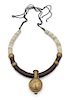 Irena Corwin, (American, 20th Century), Necklace with a Nigerian snuff bottle on a collar of coconut shell discs, bronze beads a