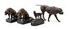 A Group of Bronze Models of Dogs Length of largest 15 1/2 inches.