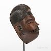 Ogoni Face Mask, hollowed-out form with narrow face and small, wide, upwards curved nose, full dark lips, and slit pierced eyes with bl