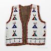 Sioux Pictorial Buffalo Hide Beaded Vest, fourth quarter 19th century, stitched in translucent red, three shades of blue, and yellow on